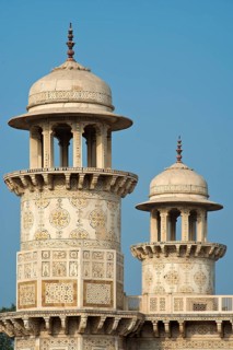 Towers with intricate marble inlays of an Islamic mausoleum