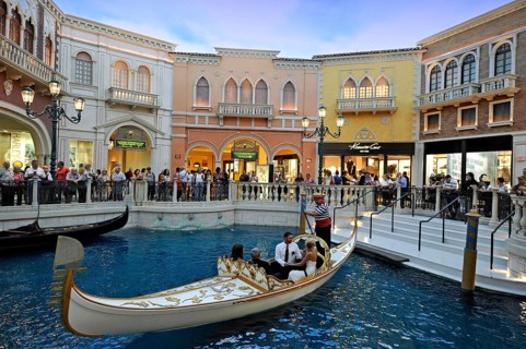 Tourists in a replica of Venetian streets under an artificial sky