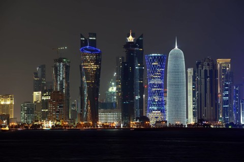 Skyline of Doha at night with the Al Bidda Tower