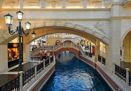 Tourists in a replica of Venetian streets under an artificial sky