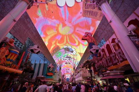 Tourists marvelling at the laser show in the neon dome of the Fremont Street Experience in old Las Vegas