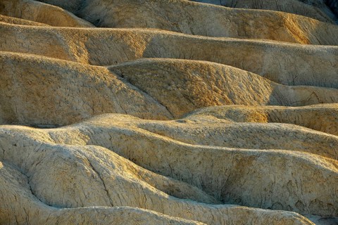 View from Zabriskie Point over eroded rock formations discoloured by minerals