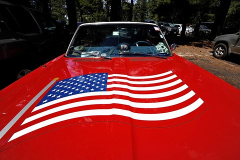 Red Plymouth Fury 67 with the U.S.-American flag painted on the hood