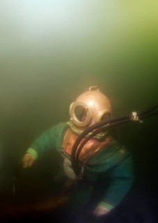 Professional diver checking a pipeline
