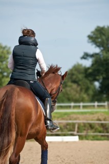 Woman riding a horse