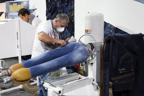 Jean production at the stand of "Pepe Jeans"