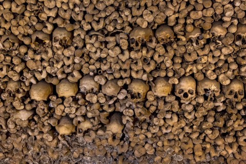 Stacked bones and skulls in the ossuary