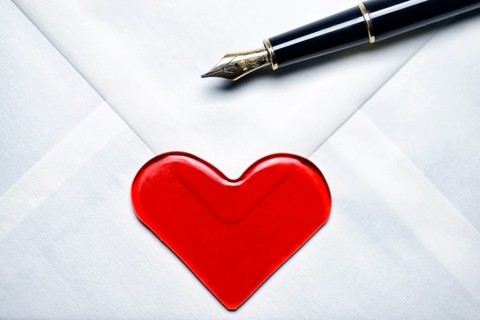 Love letter with a heart and a fountain pen