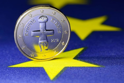 One euro coin from Cyprus on an EU flag