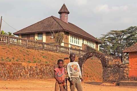 Children standing in front of the Palace Museum
