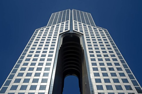 Dubai Dusit Thani Hotel on Sheikh Zayed Road against a blue sky