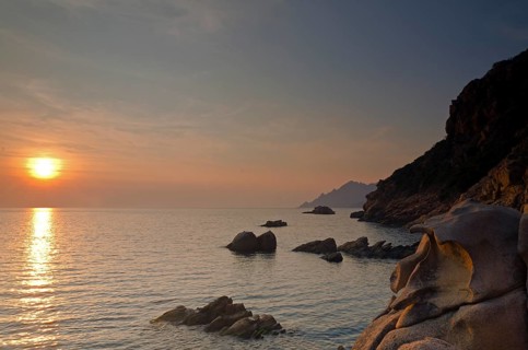 The Gulf of Porto with the surrounding mountains at sunset