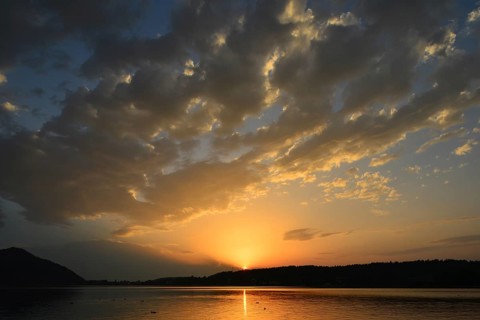 Sunset with clouds above Lake Klopeiner See
