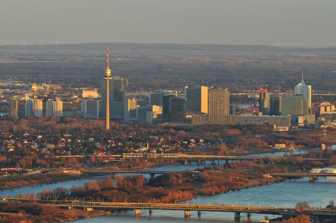 The city of Vienna and the New Danube river at dusk