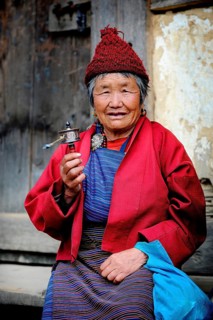 Woman holding a prayer wheel
