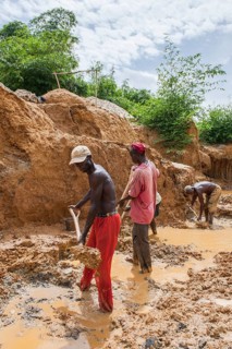 Workers digging at a diamond mine in the jungle