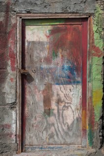 Paint-smeared door of a fisherman's hut