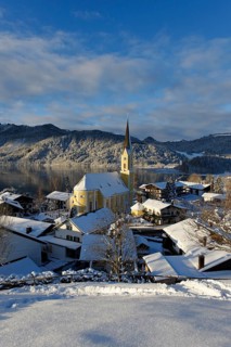 Lake Schliersee with the Church of St. Sixtus in winter