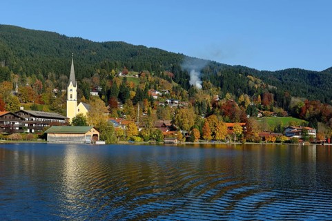 The town of Schliersee with the Church of St. Sixtus in autumn