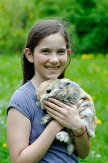 Girl holding a dwarf rabbit