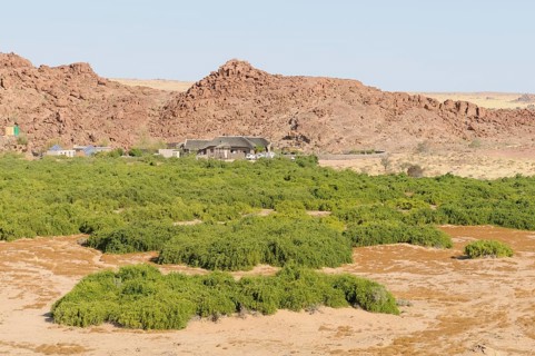 The Brandberg White Lady Lodge above the dry riverbed of the Ugab river