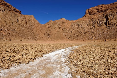 Salt pan in the volcanic landscape of the lower Ouksem Crater