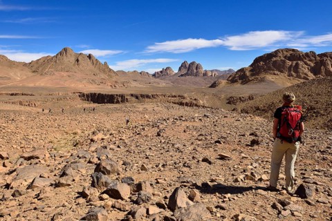 Female hiker standing in the volcanic landscape at Atakor