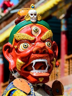 Monk performing ritual mask dance