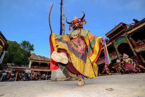 Monk performing ritual mask dance