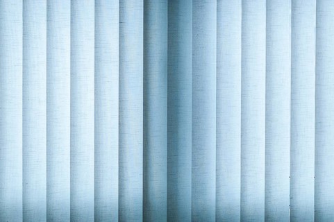 Blue blinds made of fabric with backlighting