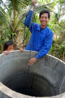 Man fetching water from a well