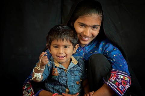 Young Rabari Woman with child in traditional clothes