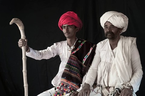 Young and old Rabari tribe men with walking stick