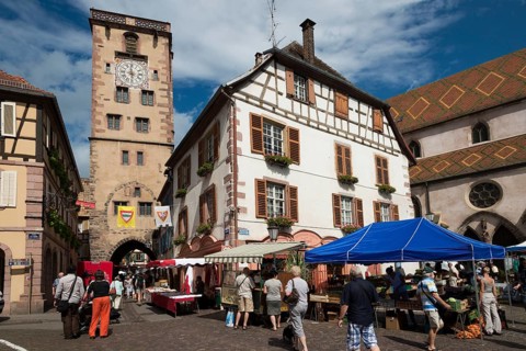 Place de Hotel de Ville with a market and the city tower