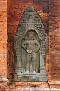 Bas-relief of a male guardian figure holding a trident-spear in his hand