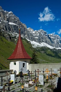 Mountain cemetery at the St. Erhard chapel at the foot of the Glarus Alps