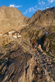 Hiker at Rifugio Pagari mountain hut