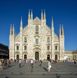 Tourists in front of the west facade of Milan Cathedral or Duomo di Santa Maria Nascente