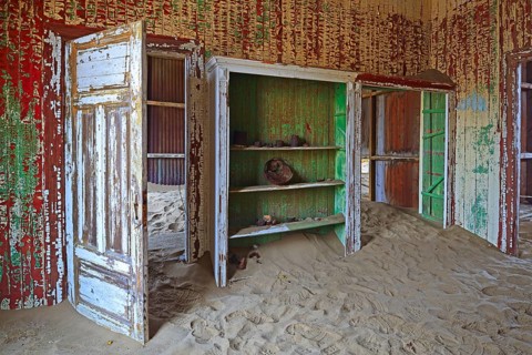 Building taken over by sand from the desert