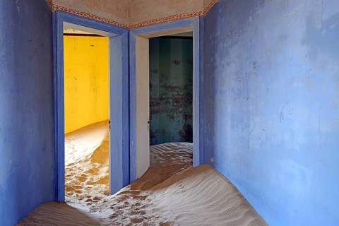 Building taken over by sand from the desert