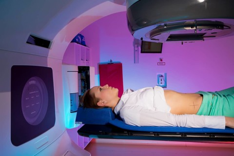 Patient lying in a linear particle accelerator for radiation treatment