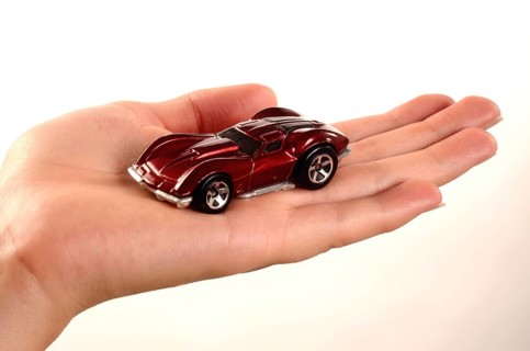 Hand holding a miniature car