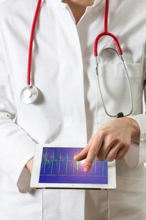 Female doctor holding a tablet computer