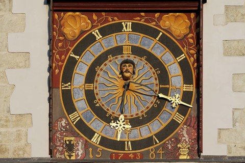 Turret clock with a painted clock face