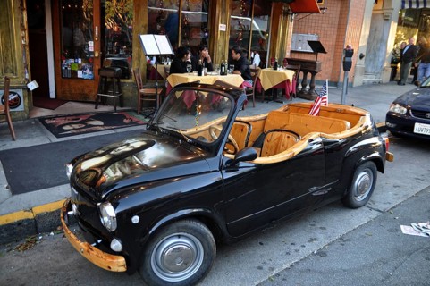 Mona Lisa Mini in front of street cafe