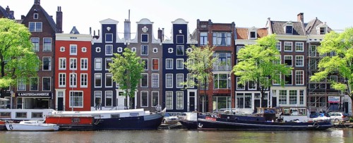Typical canal houses and boats along the Amstel Canal