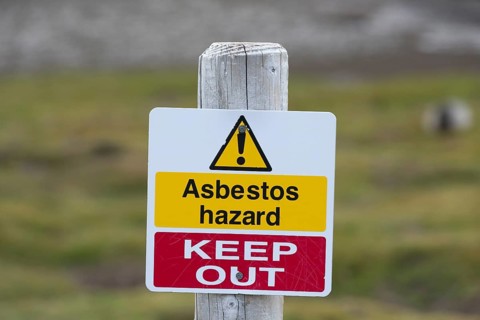 Warning sign "Asbestos hazard - keep out" at the Stromness whaling station