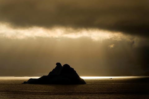Sunlight shining through a hole in the clouds