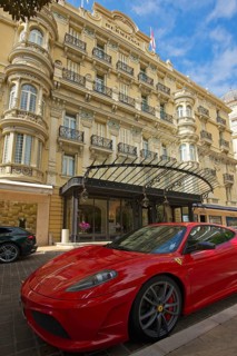 Red Ferrari parked in front of the Hermitage Hotel