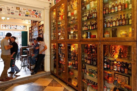 Various beer bottles in display cabinets